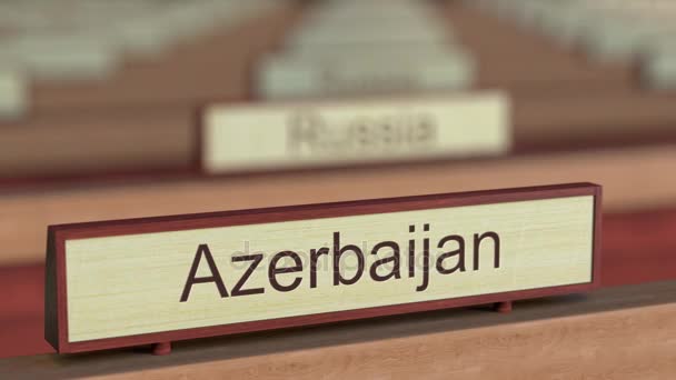 Azerbaijan name sign among different countries plaques at international organization. 3D rendering — Stock Video