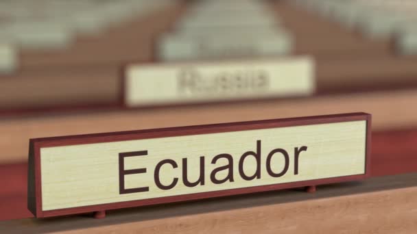 Ecuador name sign among different countries plaques at international organization — Stock Video