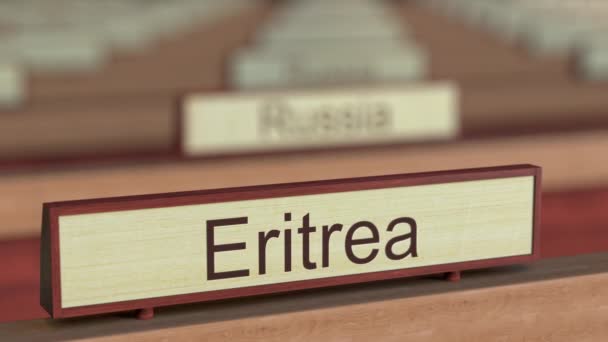 Eritrea name sign among different countries plaques at international organization — Stock Video