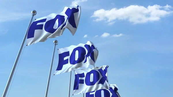 Waving flags with Fox logo against sky, editorial 3D rendering — Stock Photo, Image