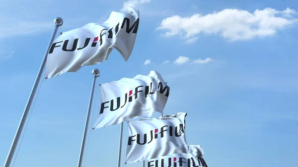 Bandiere sventolanti con logo Fujifilm contro il cielo, rendering editoriale 3D — Foto Stock