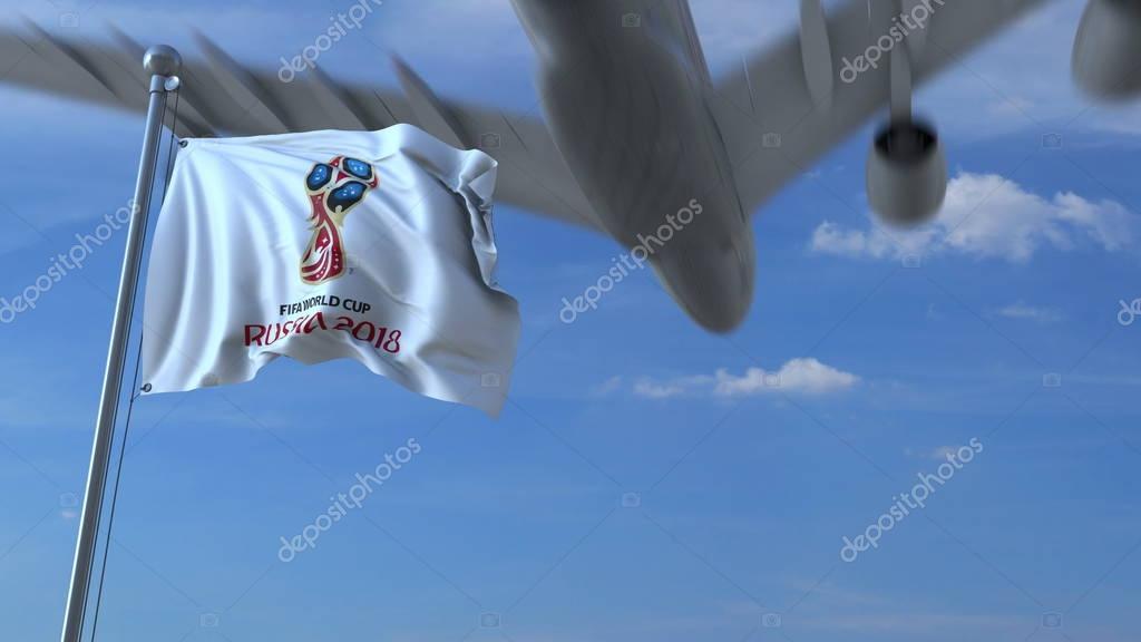 Big commercial airplane arriving to Russia over waving flag with 2018 FIFA World Cup logo