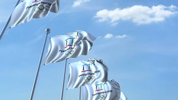 Кілька розмахуючи прапори з 2018 році зимових Олімпійських Pyeongchang логотип. Редакційні 3d-рендерінг — стокове фото
