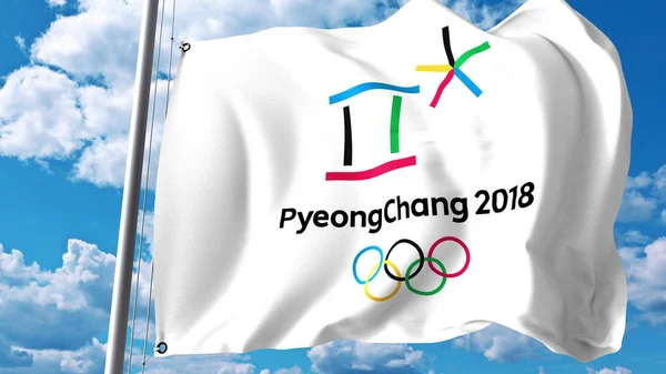 Heiluttaen lippua 2018 talviolympialaisten logolla pilviä ja taivasta vastaan. Toimituksellinen 3D-renderointi — kuvapankkivalokuva