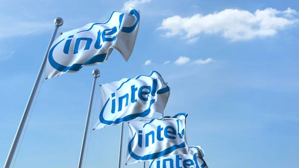 Ondeando banderas con el logotipo de Intel contra el cielo, representación editorial 3D —  Fotos de Stock