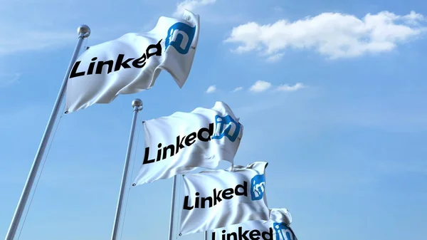 Acenando bandeiras com o logotipo do LinkedIn contra o céu, renderização 3D editorial — Fotografia de Stock
