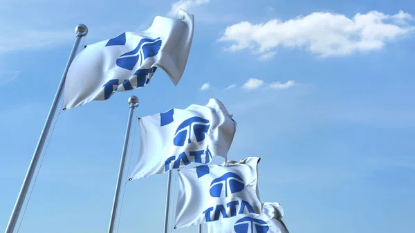 Bandiere sventolanti con logo Tata contro il cielo, rendering editoriale 3D — Foto Stock