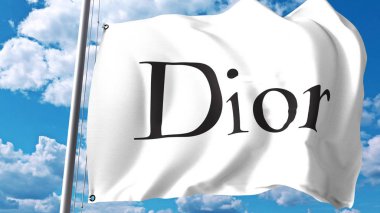 Waving flag with Christian Dior SE logo against clouds and sky. Editorial 3D rendering clipart