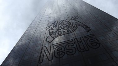 Nestle logo on a skyscraper facade reflecting clouds. Editorial 3D rendering clipart