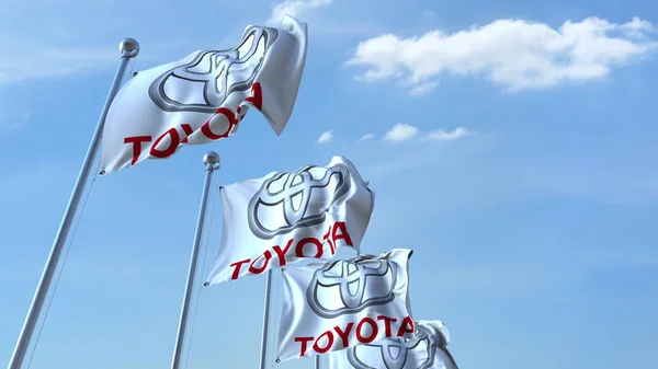 Drapeaux agitant le logo Toyota contre le ciel, rendu éditorial 3D — Photo