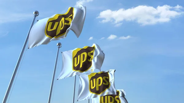 Waving flags with UPS logo against sky, editorial 3D rendering — Stok Foto