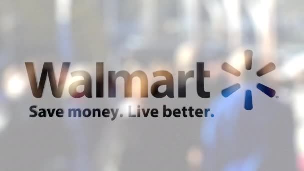 Logo Walmart pada kaca melawan kerumunan kabur di atas steet. Perenderan 3D Editorial — Stok Video