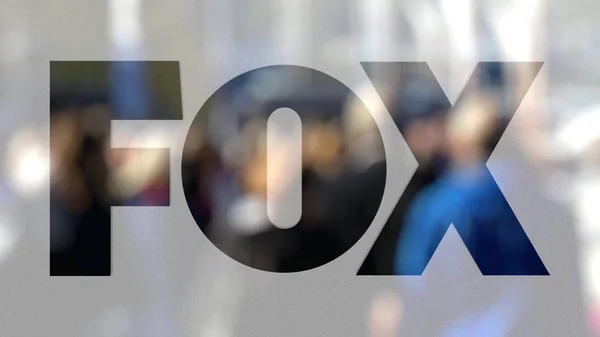 Fox Broadcasting Company logo on a glass against blurred crowd on the steet. Editorial 3D rendering — Stock Photo, Image