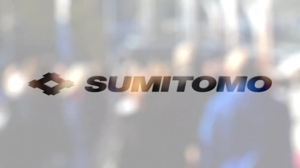 Sumitomo Corporation logo on a glass against blurred crowd on the steet. Editorial 3D rendering — Stock Video