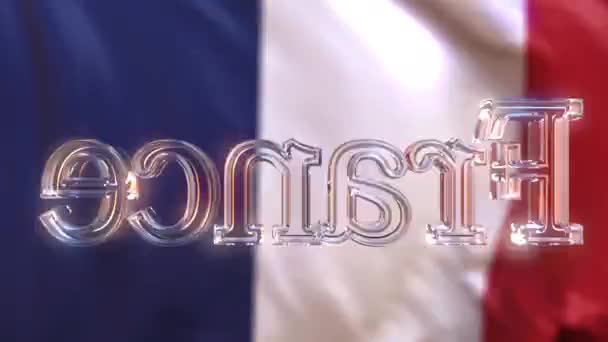 Rotating glass France caption against waving French flag. Loopable motion background or intro animation — Stock Video