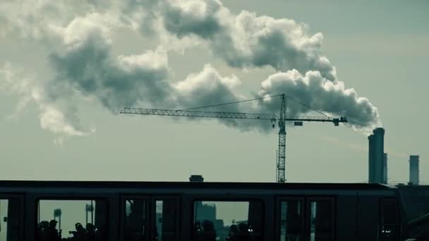 PARIS, FRANCE - OCTOBER 7, 2017. Smoking pipes and tower crane silhouette — Stock Video