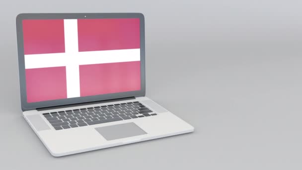 Opening and closing laptop with flag of Denmark on the screen. Tourist service, travel planning or cultural study concepts — Stock Video