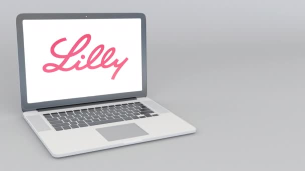 Openen en sluiten van laptop met Eli Lilly And Company logo. 4 k redactionele animatie — Stockvideo