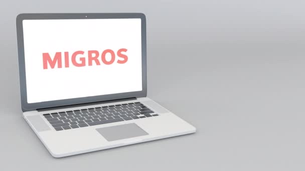 Portátil de apertura y cierre con logo Migros. Animación editorial 4K — Vídeo de stock