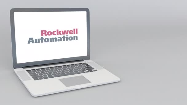 Abrir e fechar laptop com o logotipo da Rockwell Automation. Animação editorial 4K — Vídeo de Stock