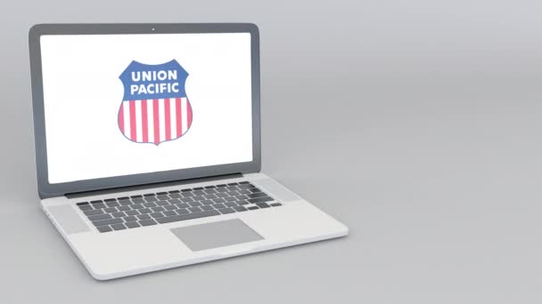 Öppna och stänga laptop med Union Pacific Railroad logotyp. 4 k redaktionella animation — Stockvideo