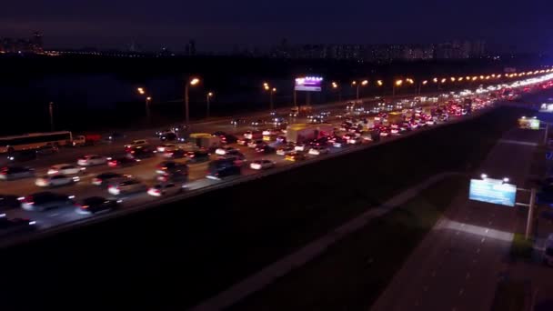 Aerial travelling shot of huge motorway traffic jam in the evening rush hour — Stock Video