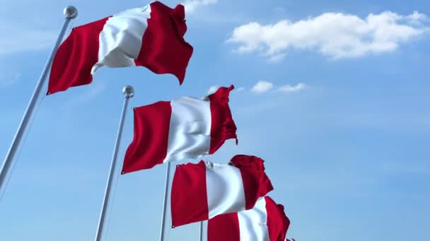 Multiple waving flags of Peru against the blue sky, seamless loop — Stock Video