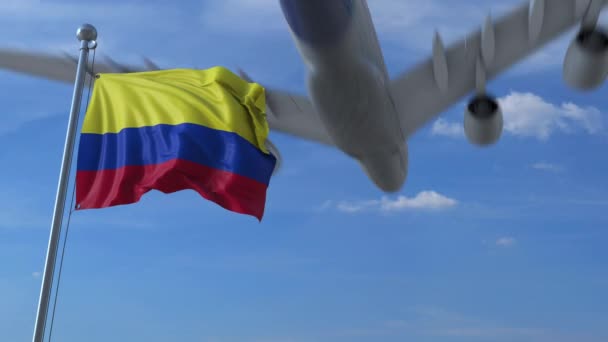 Airplane flying over waving flag of Colombia — Stock Video