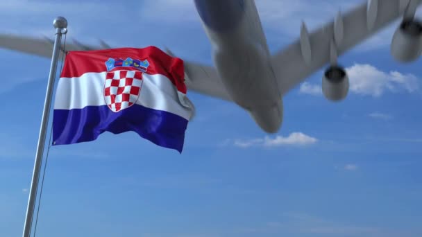 Airplane flying over waving flag of Croatia — Stock Video