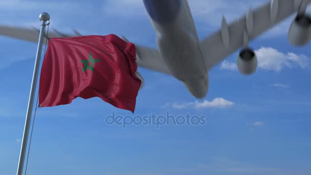 Flugzeug fliegt über schwenkender Flagge Marokkos — Stockvideo