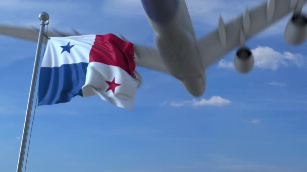 Flygplan som flyger över viftar flagga i Panama — Stockvideo