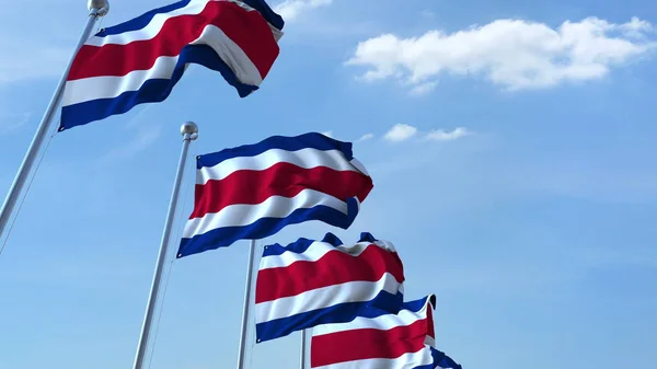 Múltiples banderas ondeantes de Costa Rica contra el cielo azul. Renderizado 3D — Foto de Stock