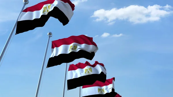 Více vlající vlajky Egypta proti modré obloze. 3D vykreslování — Stock fotografie