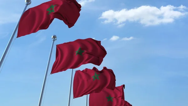 Drapeaux multiples agitant du Maroc contre le ciel bleu. rendu 3D — Photo