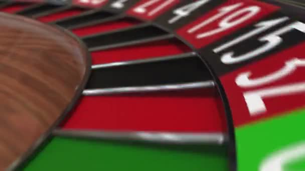 Casino roulette wheel ball hits 5 five red — Stock Video