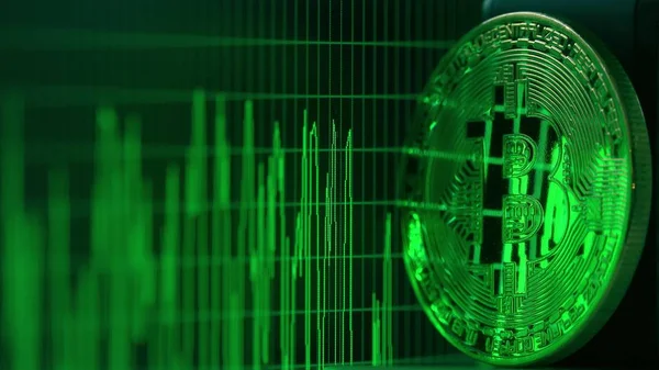 Shiny bitcoin reflects green data graph on the computer screen. Cryptocurrency related shot — Stock Photo, Image