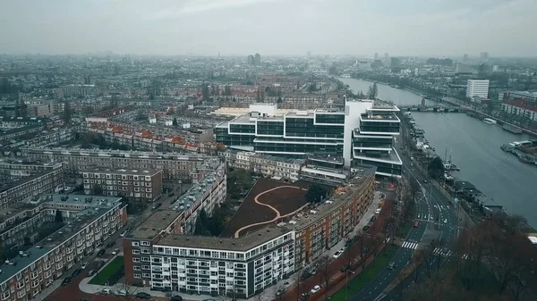 Aerial view of Amsterdam from the southern part towards city center involving the Amstel river, residential and business buildings — Stock Photo, Image