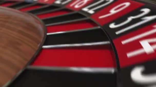 Casino roulette wheel ball hits 2 two black — Stock Video