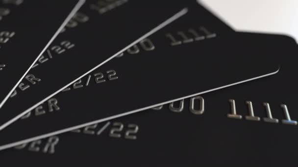 Czarne plastikowe karty kredytowe, zapętlić animacji — Wideo stockowe