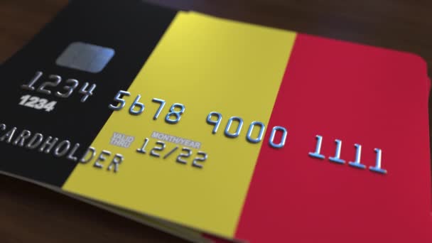 Plástico cartão bancário com bandeira da Bélgica. Animação relacionada com o sistema bancário nacional — Vídeo de Stock