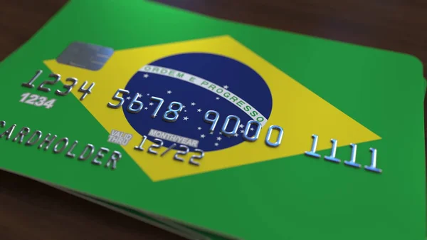 Plastic bank card featuring flag of Brazil. National banking system related 3D rendering — Stock Photo, Image