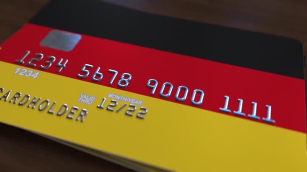 Műanyag bank kártya featuring Németország zászlaja. Nemzeti bankrendszer kapcsolódó animáció — Stock videók