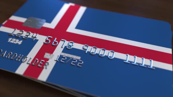 Plastic bank card featuring flag of Iceland. National banking system related animation — Stock Video