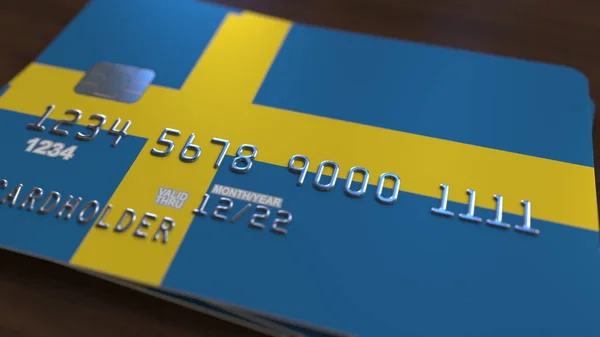 Plastic bank card featuring flag of Sweden. National banking system related 3D rendering — Stock Photo, Image
