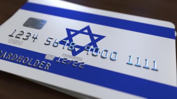 Tarjeta bancaria de plástico con bandera de Israel. Animación relacionada con el sistema bancario nacional — Vídeo de stock