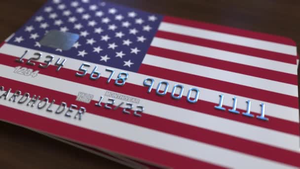 Plastic bank card featuring flag of the United States. National banking system related animation — Stock Video