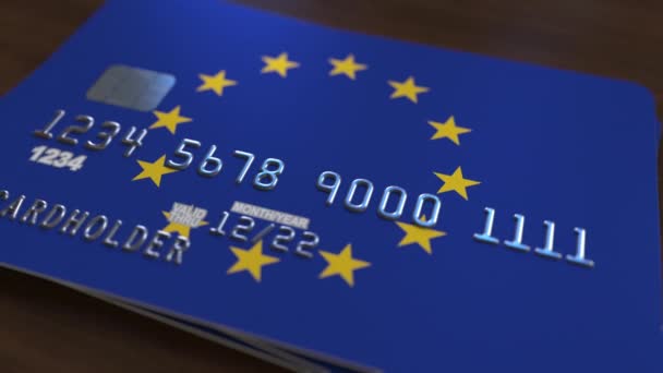 Plastic bank card featuring flag of the European Union. National banking system related animation — Stock Video