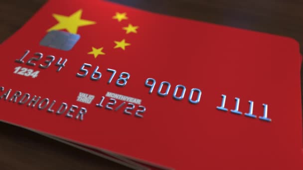 Plastic bank card featuring flag of China. National banking system related animation — Stock Video