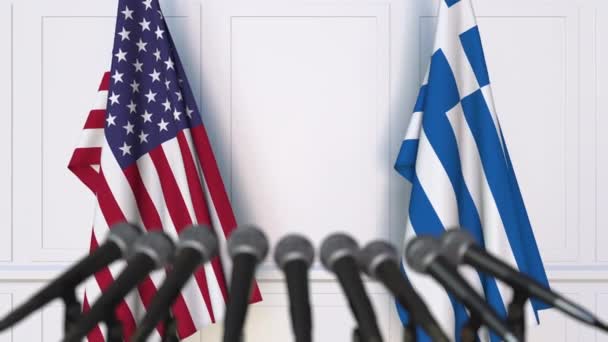 Flags of the USA and Greece at international meeting or negotiations press conference — Stock Video