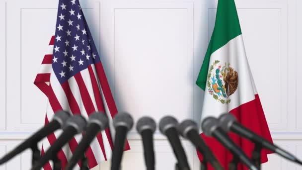 Flags of the USA and Mexico at international meeting or negotiations press conference — Stock Video